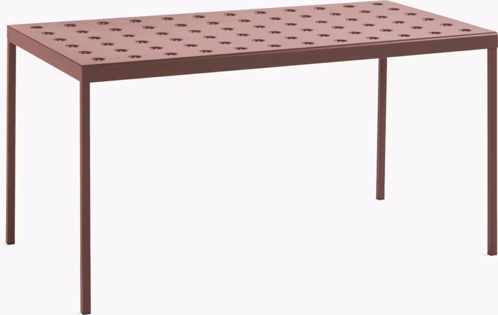 A modern, rectangular table with a perforated top and slender legs, featuring a reddish-brown finish.