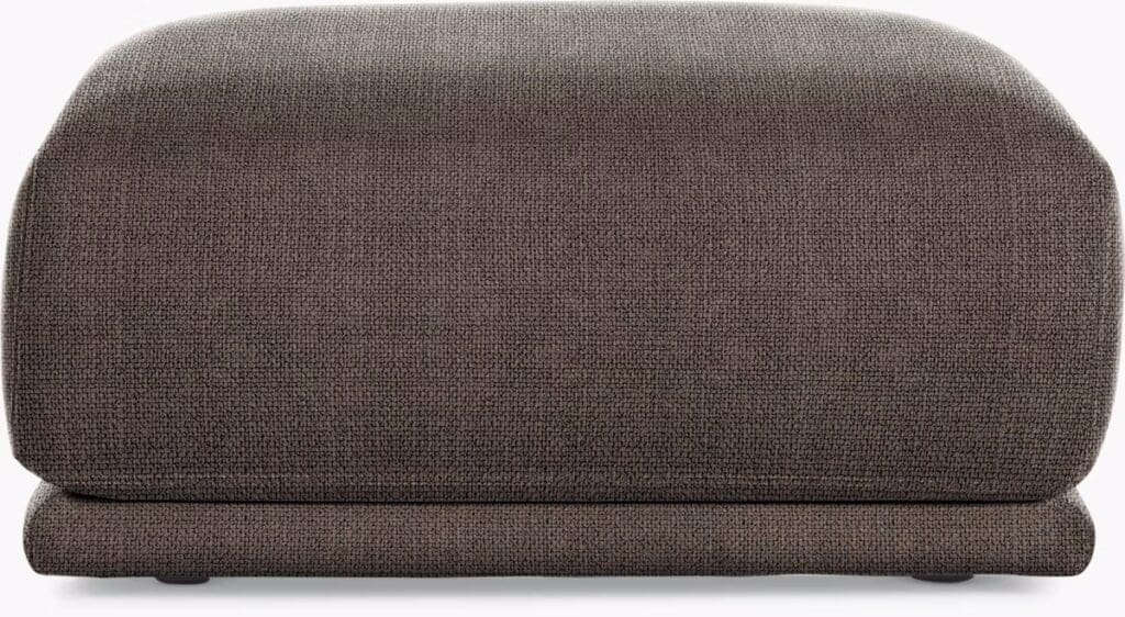 A textured, dark brown upholstered furniture piece featuring a rounded top and a low-profile design.