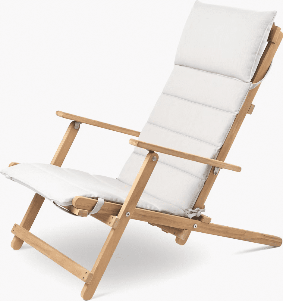 A modern wooden lounge chair with a white cushioned seat and backrest, designed for comfort and relaxation in outdoor settings.