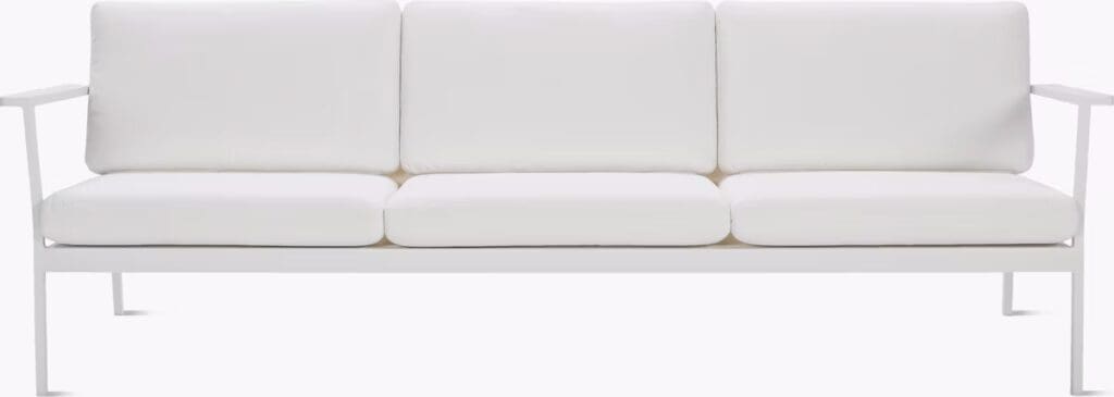 A modern white sofa with adjustable cushions and a sleek minimalist design.