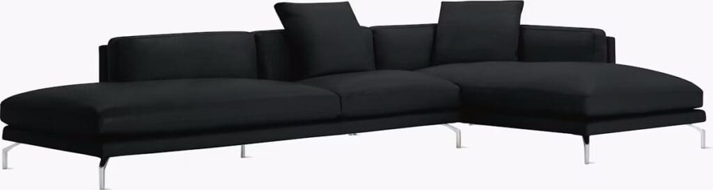 A modern black sectional sofa with plush cushions and minimalistic design.