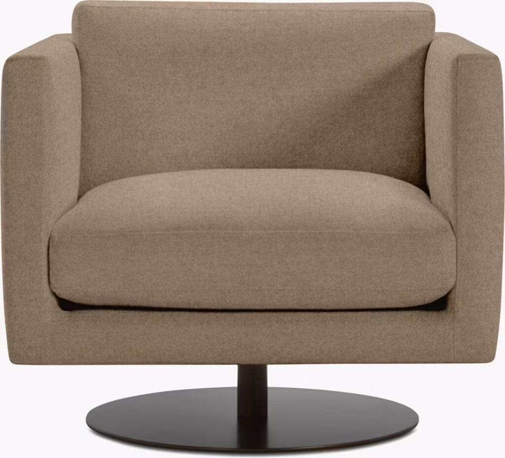 A modern, stylish armchair upholstered in beige fabric, featuring a round black base.