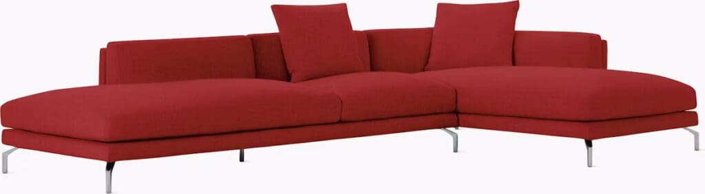 Red modern sectional sofa with cushions.