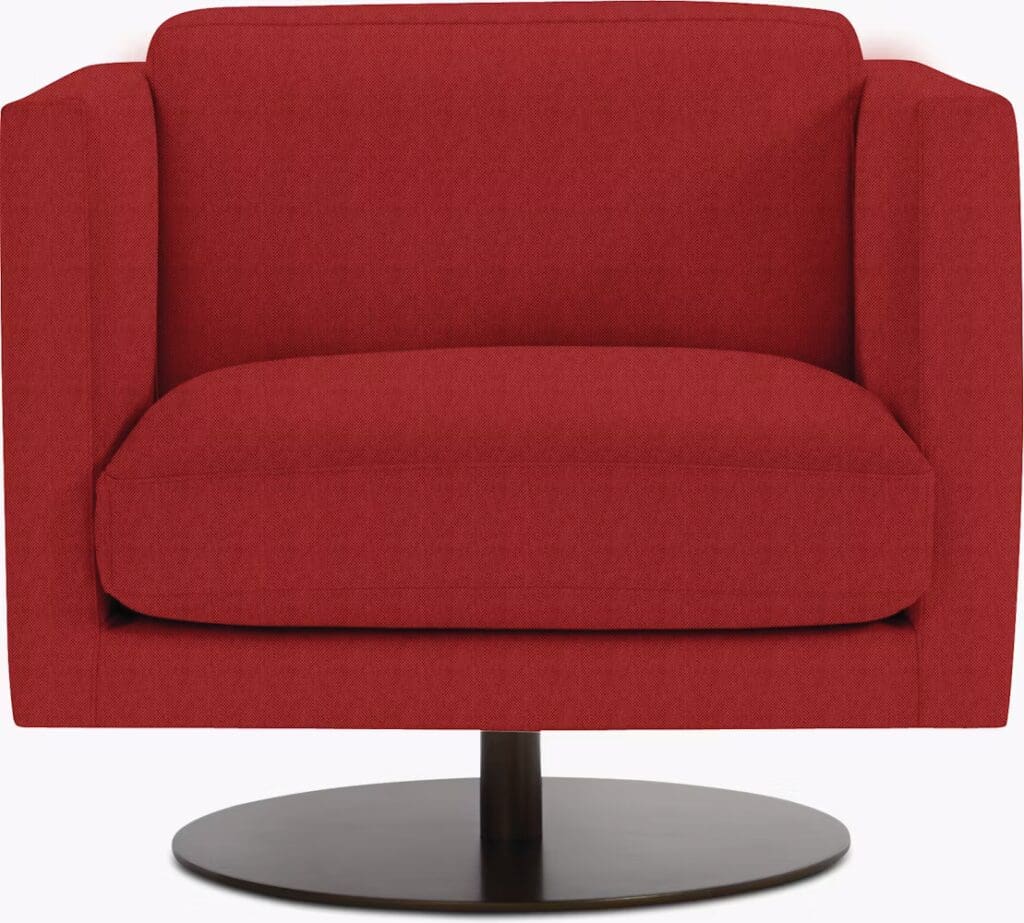 A modern red armchair with a plush cushion and a circular base, designed for comfort and style.