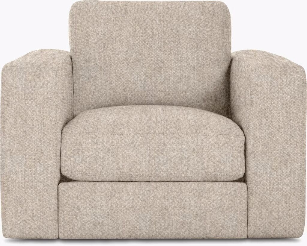 A cozy light beige armchair with a simple and modern design, featuring plush cushions and rounded arms.