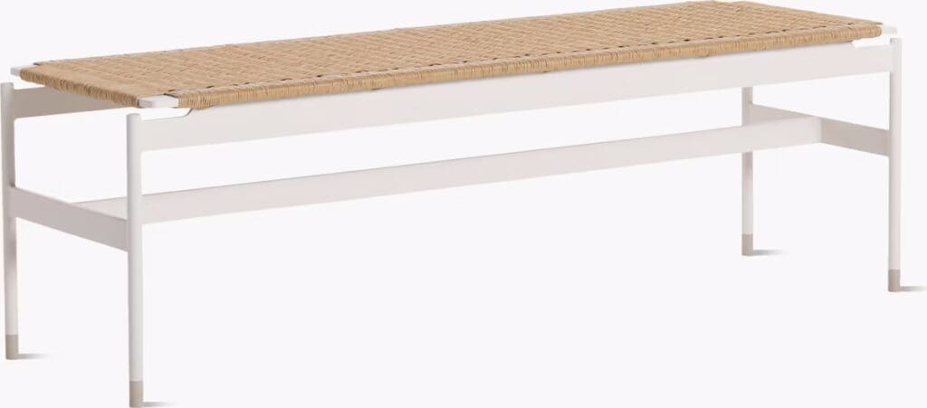 A modern white bench with a woven seat, designed with minimalistic lines, suitable for indoor or outdoor use.