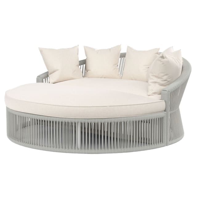 Round outdoor daybed with a grey woven base and plush cream-colored cushions, designed for relaxation.