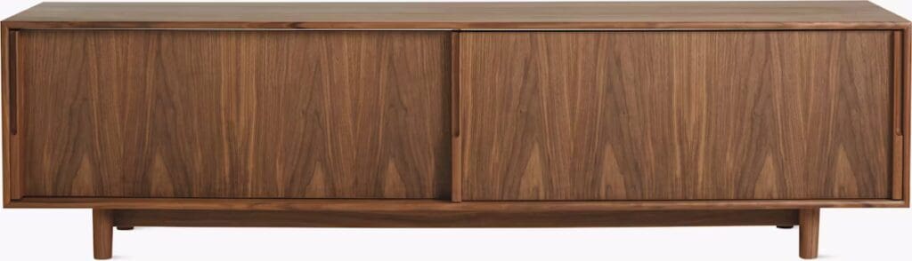 A modern wooden media console with a sleek design and sliding doors, made from walnut wood.