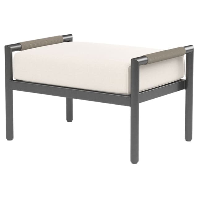 Modern outdoor ottoman with a sleek black frame and light cushion, designed for luxurious outdoor living.