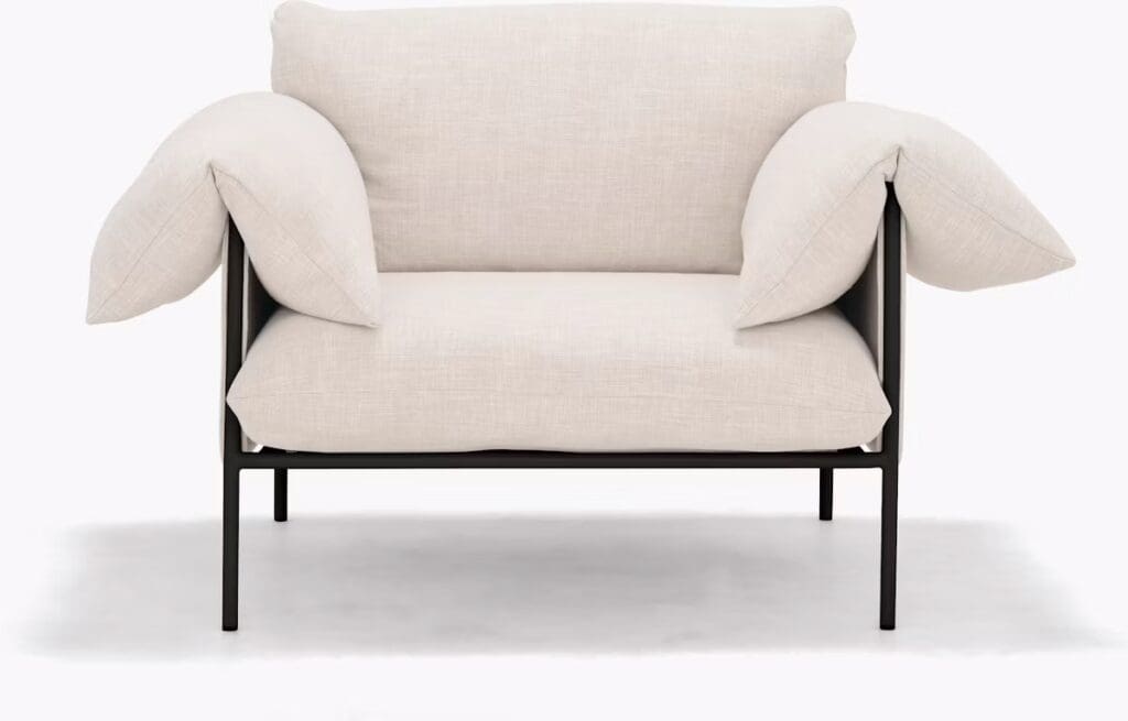 A modern armchair with a minimalist design, featuring a black frame and soft, plush cushions in light fabric.