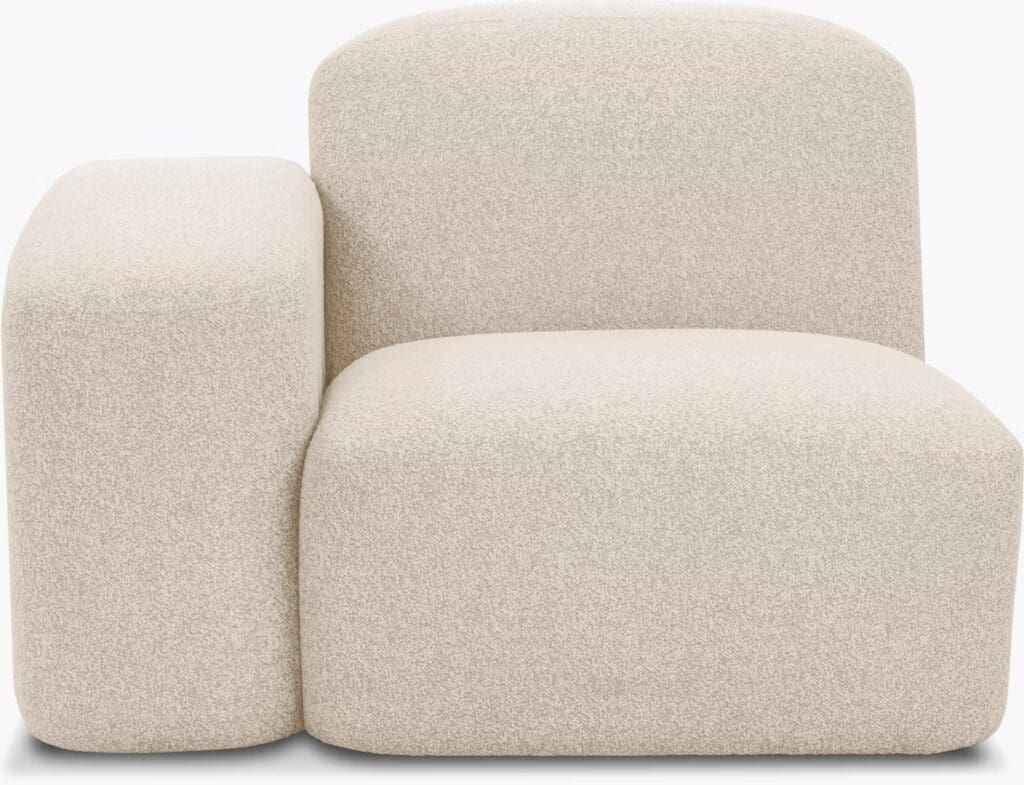 A modern, minimalist lounge chair with a uniquely curved design, upholstered in light beige fabric.