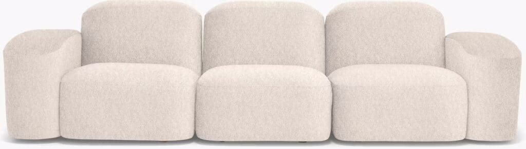 A soft, light-colored sectional sofa with rounded, plush styling and curved armrests.
