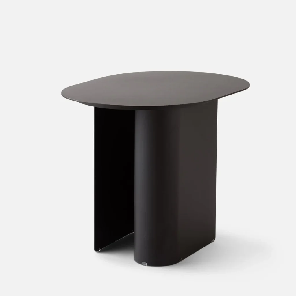 Modern black outdoor side table with a rounded top and unique leg design.