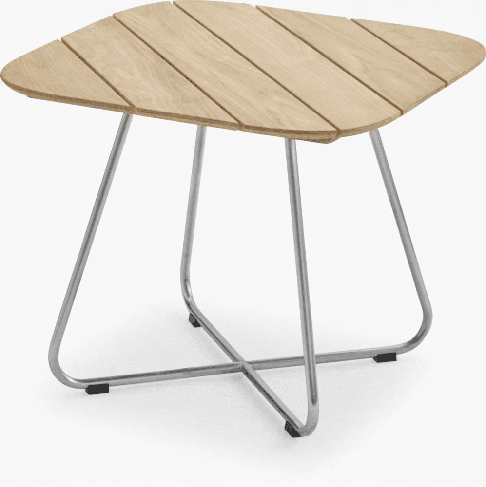Modern outdoor side table with a triangular wooden top and sleek metal legs.