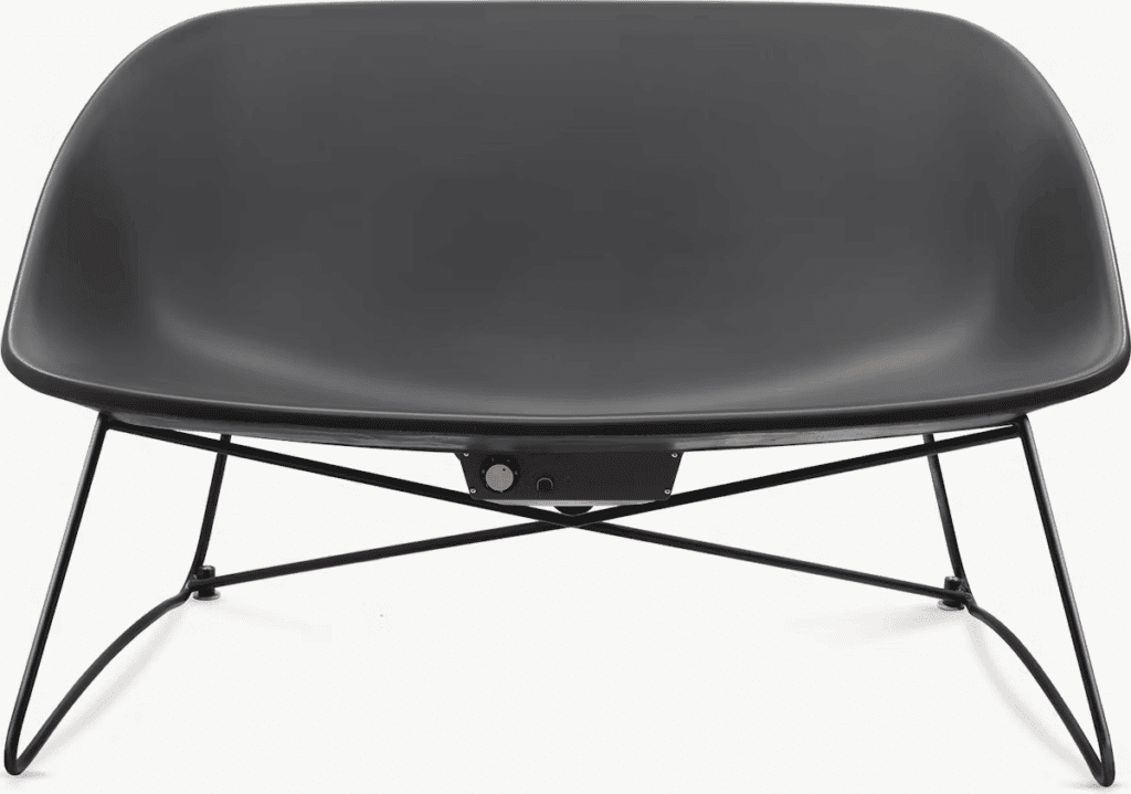 Modern black lounge chair with a sleek design and metal legs, positioned against a neutral background.