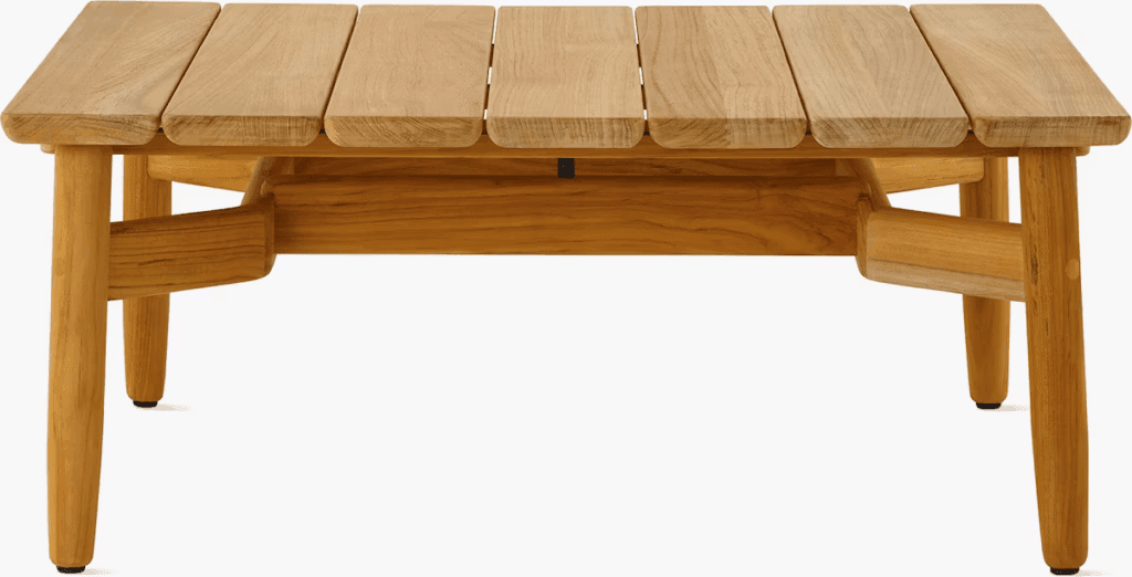 Wooden coffee table with a slatted top and tapered legs, designed for outdoor use.