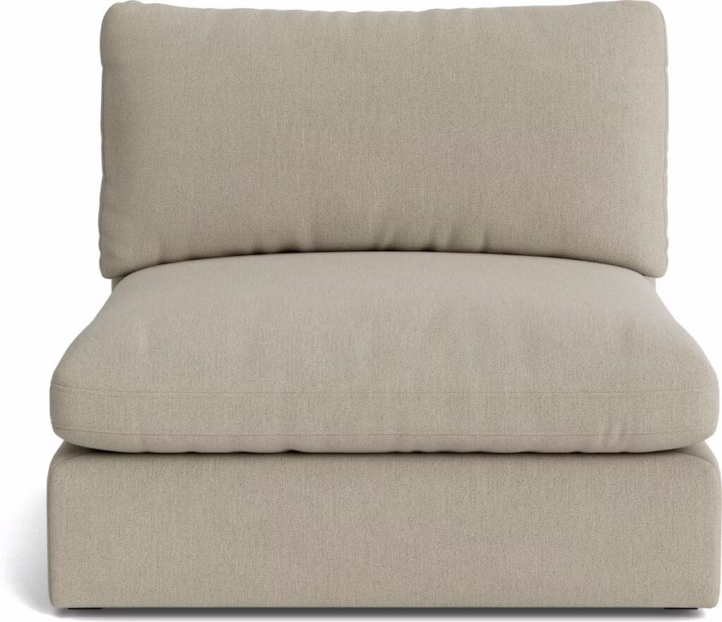 Light beige upholstered chair with a thick seat cushion and a tall backrest.