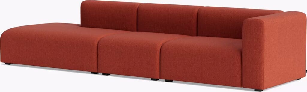 A modern red sectional sofa with a minimalist design and rounded edges.