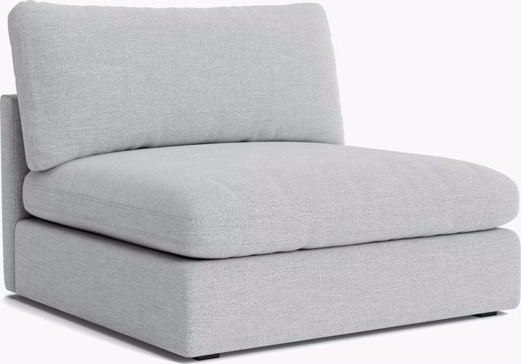 A modern gray chaise sectional sofa with a plush back cushion, designed for comfort and style.