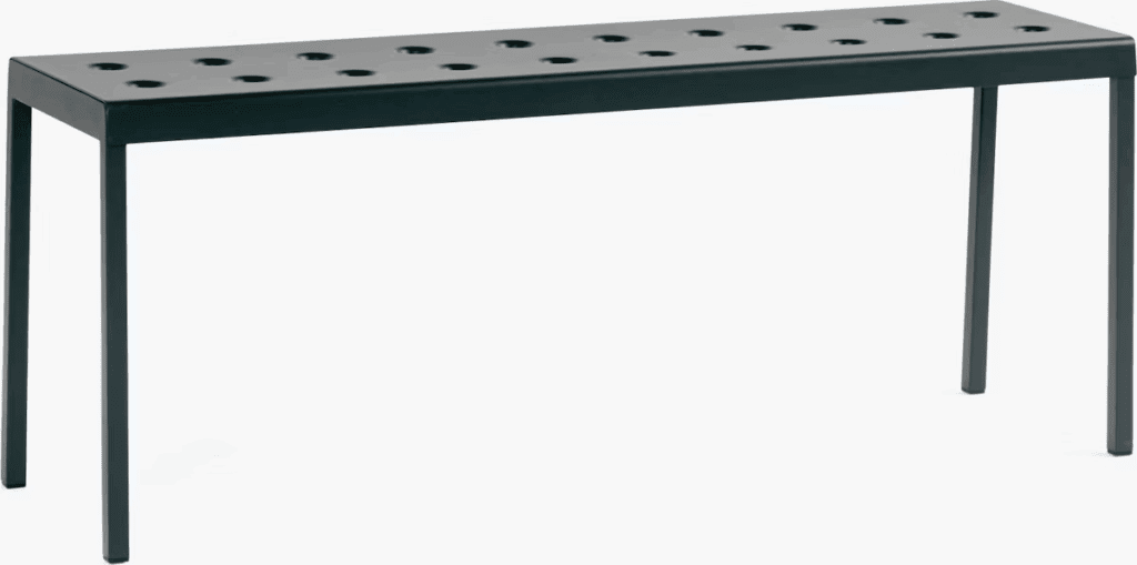 Minimalist black console table with perforated top and slender legs.
