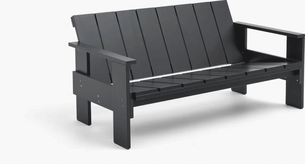 Modern black outdoor bench with a slatted design and sturdy armrests.