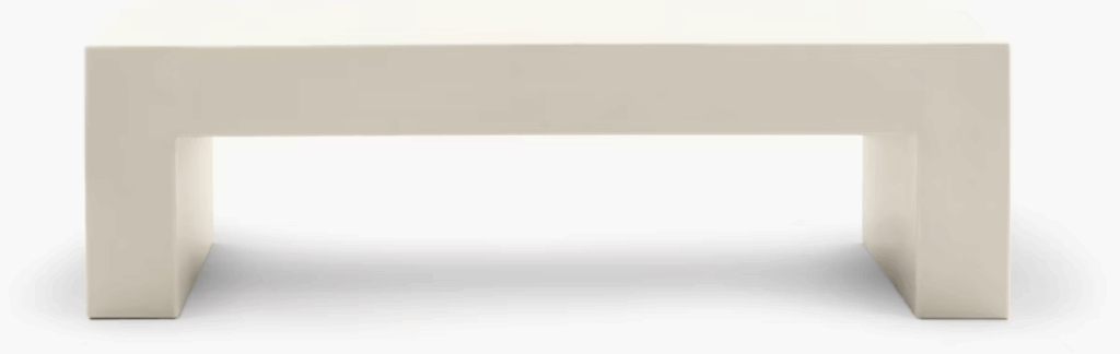 Modern white coffee table with a minimalist design, featuring a rectangular shape and sturdy legs.