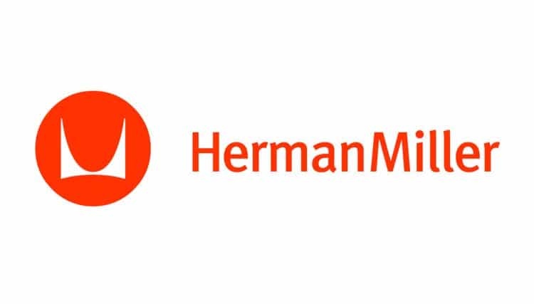 Logo of Herman Miller featuring a stylized crown icon in red and the brand name in uppercase orange letters.
