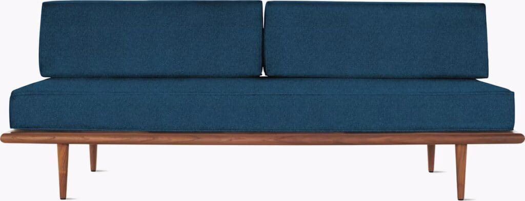 A modern dark blue sofa with two back cushions and wooden legs, designed for contemporary living spaces.