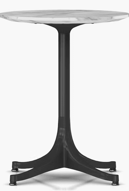 Minimalist round table with a transparent top and a sleek black base, designed for modern outdoor or indoor settings.