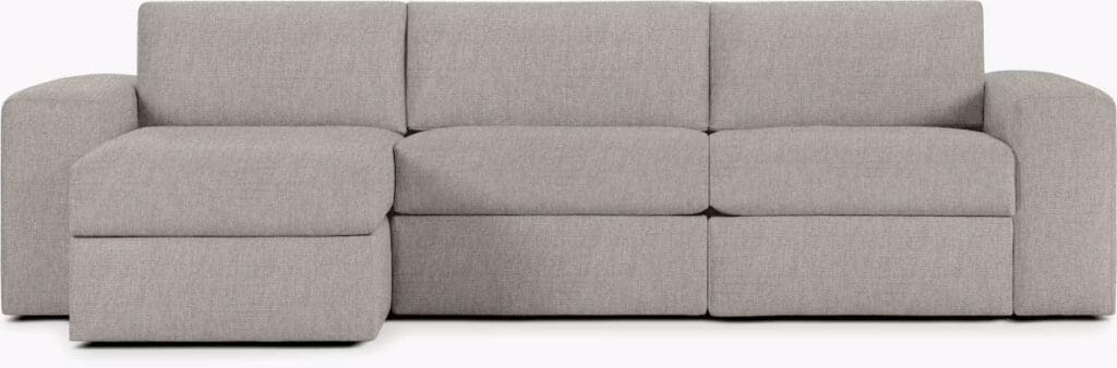A modern, light gray sectional sofa with a chaise lounge design, featuring soft, cushioned seating and clean lines.