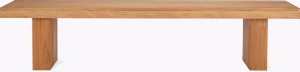 A minimalist wooden coffee table with a rectangular top and two thick, rectangular legs, showcasing a natural wood finish.