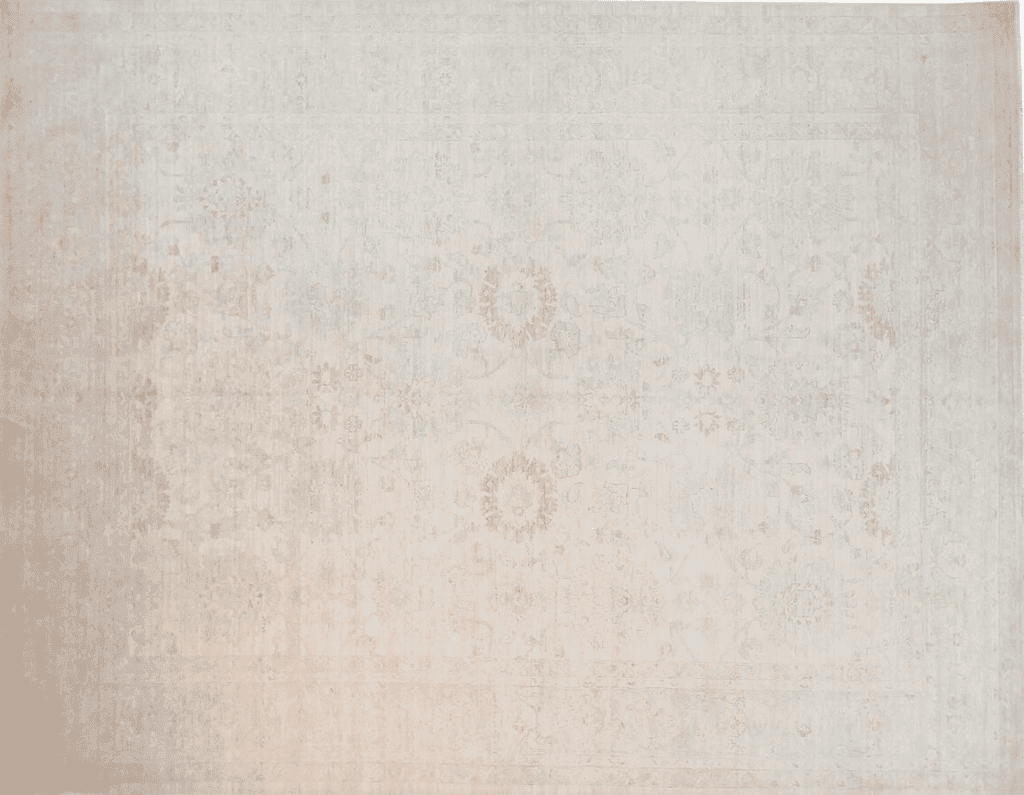 A vintage rug featuring a soft, neutral color palette with faint floral patterns, showcasing an overall worn appearance that reflects its age and character.