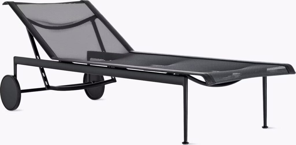 A sleek black chaise lounge with a mesh design, featuring two wheels for easy mobility.