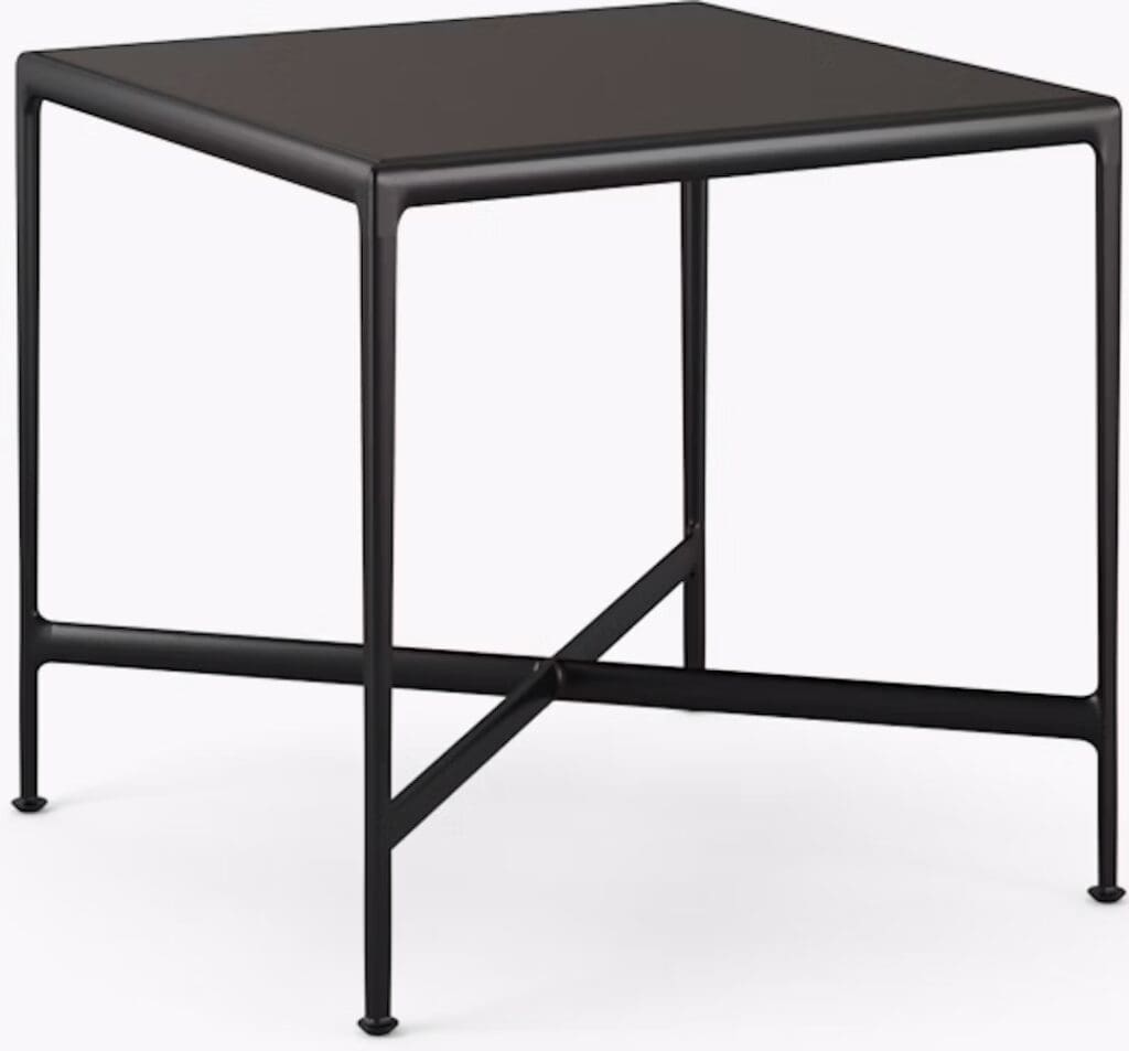 A modern black side table with a minimalist design featuring a square top and slender metal legs.