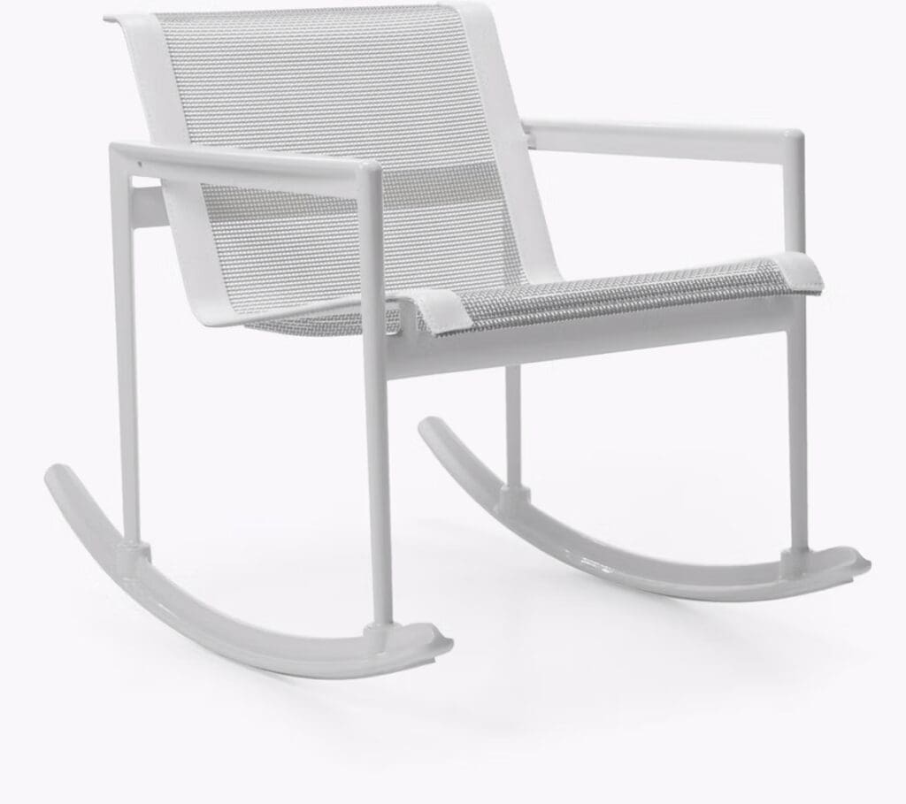 A modern white rocking chair with a woven seat and backrest, set against a plain background.
