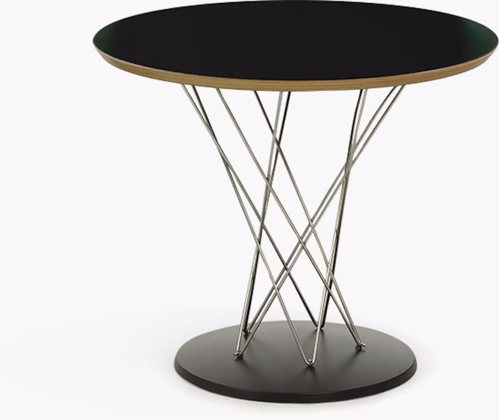 A modern black round table with a sleek wooden edge and a unique metal base featuring intersecting wires.