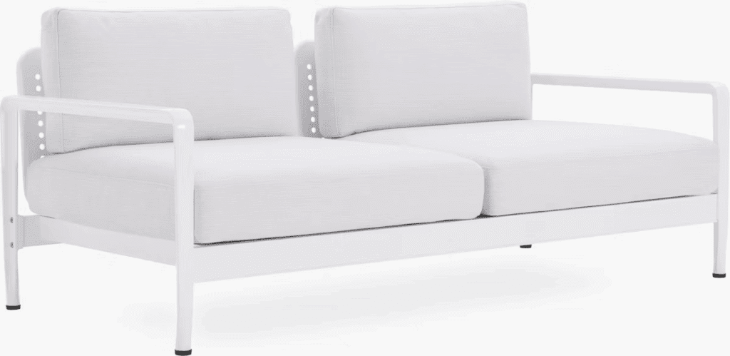 Modern two-seater outdoor sofa with white cushions and a sleek white frame.