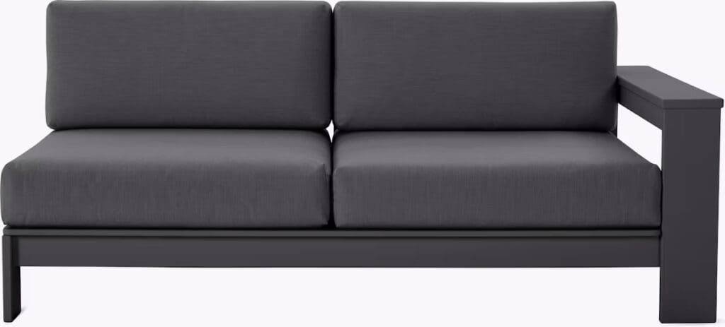 Modern gray outdoor sectional sofa with a sleek design and single armrest.