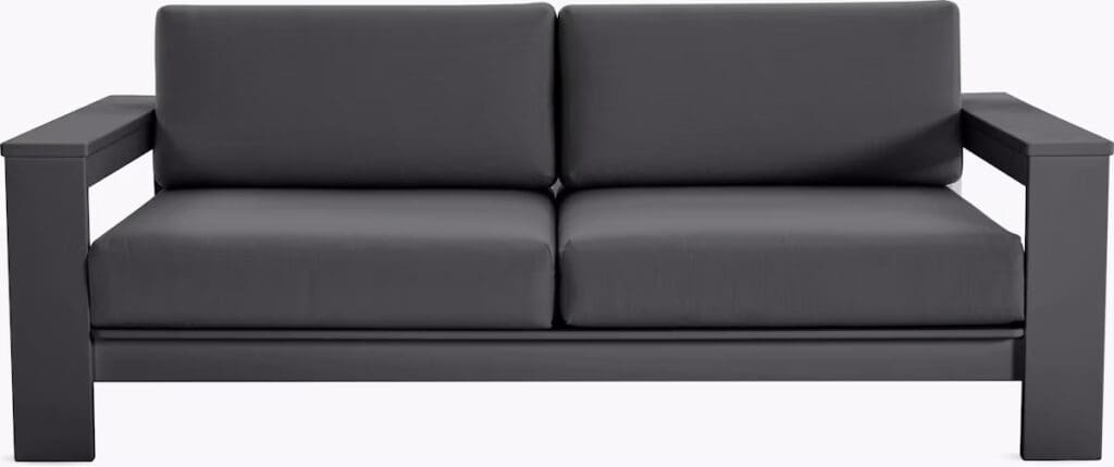Modern black sofa with sleek lines and minimalist design.