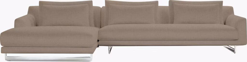 A modern sectional sofa in a light brown fabric, featuring clean lines and plush back cushions, designed for comfort and contemporary style.