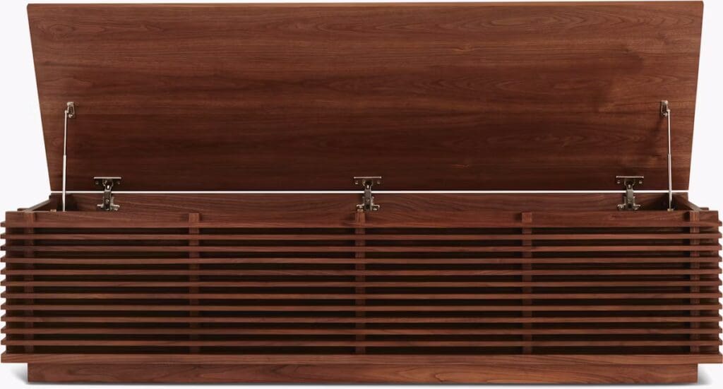 A wooden storage box with a slatted design and an open lid, showcasing the interior.