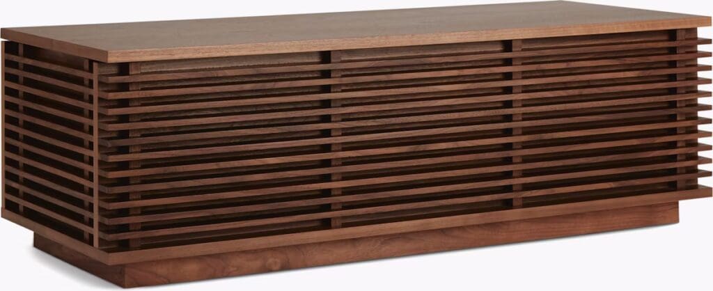 A modern wooden coffee table with a slatted design, showcasing a warm walnut finish.