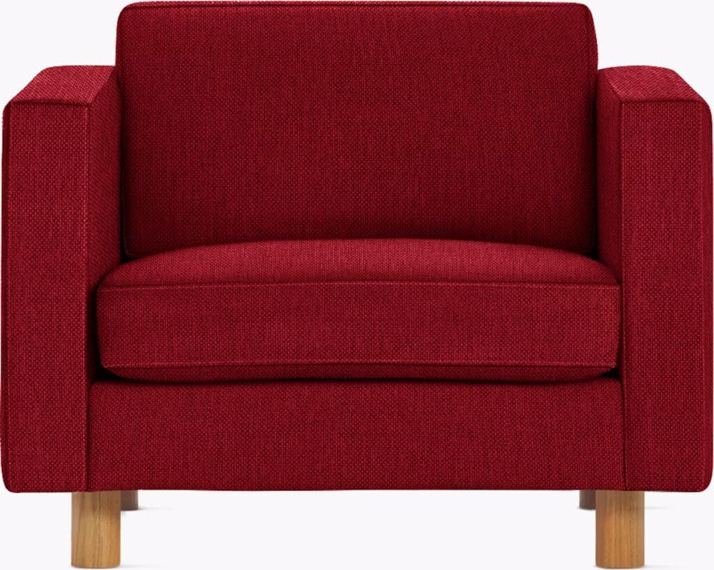 Front view of a modern red armchair with a simple, geometric design and wooden legs.
