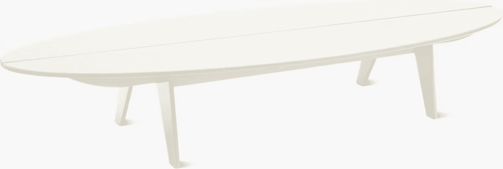 Modern white patio table with a smooth oval top and angled legs.