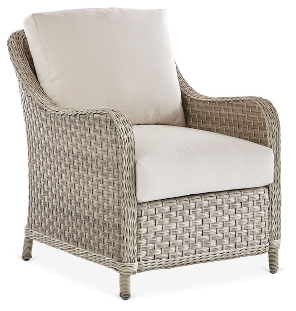 Comfortable outdoor wicker armchair with light-colored cushion.