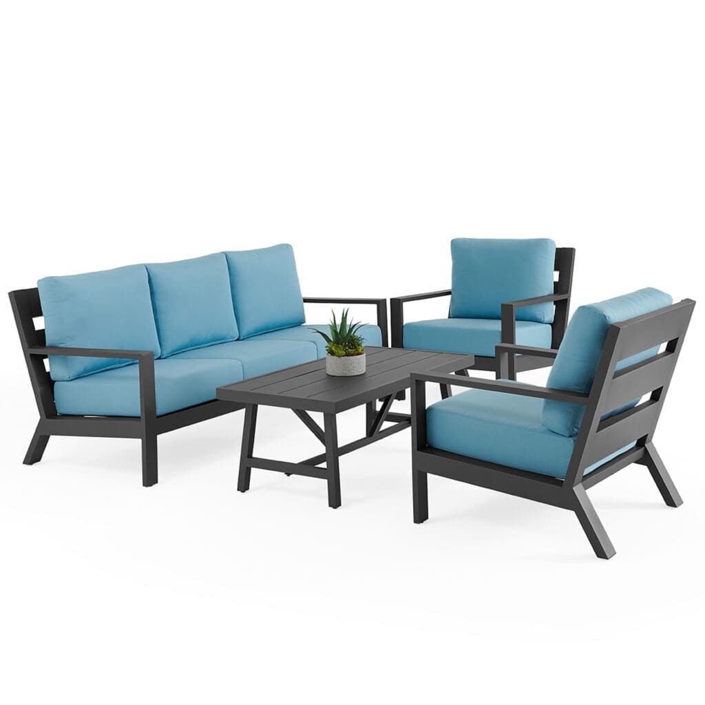 Modern outdoor seating arrangement featuring a dark wooden frame with bright blue cushions, complemented by a matching coffee table and a small potted plant.