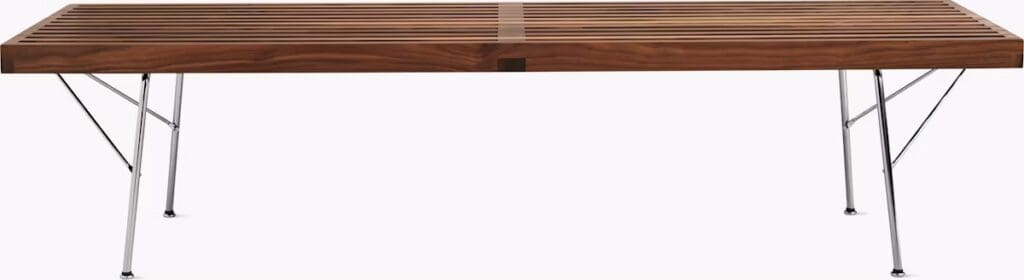 A modern coffee table with a slatted wooden top and metal legs, showcasing a stylish and minimalist design.