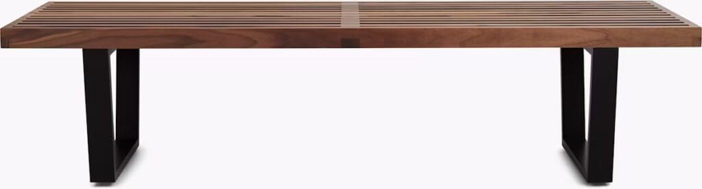 A modern coffee table with a slatted wood top and sturdy black metal legs, featuring a sleek and minimalist design.