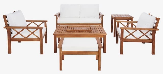 Outdoor seating set featuring a wooden table, two armchairs, and a loveseat, all with white cushions.