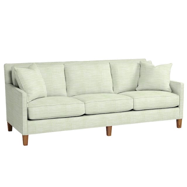 Modern striped sofa with light green and white fabric, featuring three back cushions and two throw pillows.